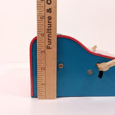 LOT 39: Vintage Wolverine Arithmetic Quiz Tin Toy