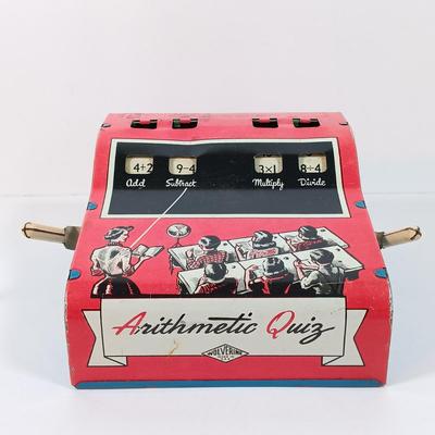 LOT 39: Vintage Wolverine Arithmetic Quiz Tin Toy