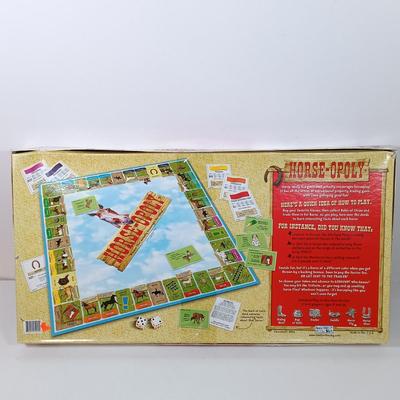 LOT 46: Lego Architecture Eiffel Tower, Criss Angel Mind Freak Platinum Magic Kit, Horse-Opoly & 550 Pc The Alchemist Puzzle