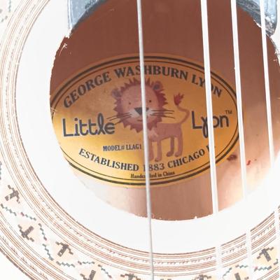 LOT 51: George Washburn Lyon LLAG1 Little Lion Children's Guitar, Camp Mickey Cookout Set, Planes Board Books & More