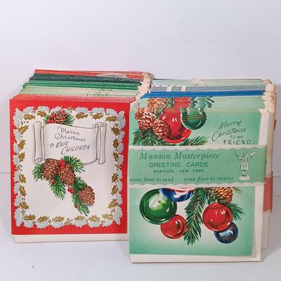 LOT 52: Vintage Munson Masterpiece Christmas Greeting Cards, Hallmark Mickey's Merry Carousel Ornament, A Dickens Christmas Cottages...