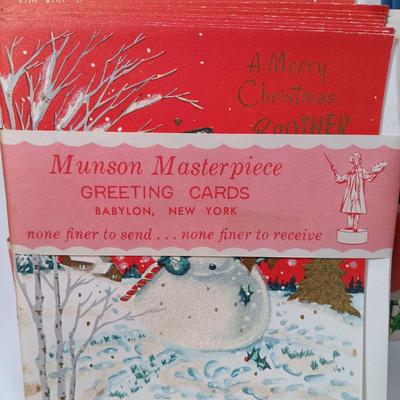 LOT 52: Vintage Munson Masterpiece Christmas Greeting Cards, Hallmark Mickey's Merry Carousel Ornament, A Dickens Christmas Cottages...