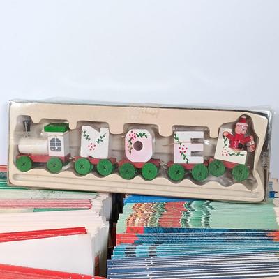 LOT 52: Vintage Munson Masterpiece Christmas Greeting Cards, Hallmark Mickey's Merry Carousel Ornament, A Dickens Christmas Cottages...