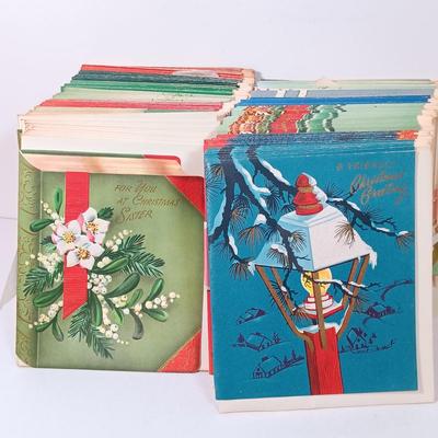 LOT 52: Vintage Munson Masterpiece Christmas Greeting Cards, Hallmark Mickey's Merry Carousel Ornament, A Dickens Christmas Cottages...