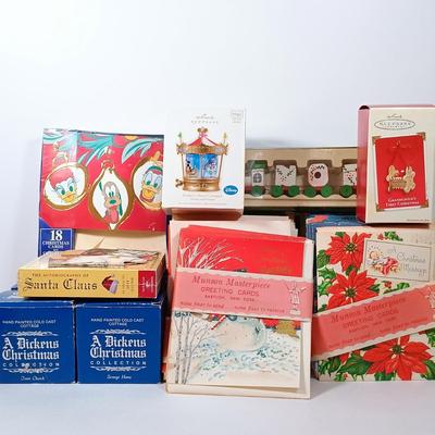 LOT 52: Vintage Munson Masterpiece Christmas Greeting Cards, Hallmark Mickey's Merry Carousel Ornament, A Dickens Christmas Cottages...