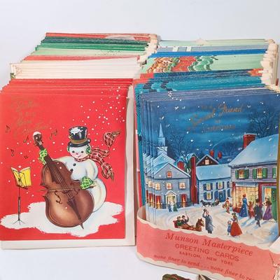 LOT 52: Vintage Munson Masterpiece Christmas Greeting Cards, Hallmark Mickey's Merry Carousel Ornament, A Dickens Christmas Cottages...