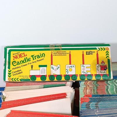 LOT 52: Vintage Munson Masterpiece Christmas Greeting Cards, Hallmark Mickey's Merry Carousel Ornament, A Dickens Christmas Cottages...