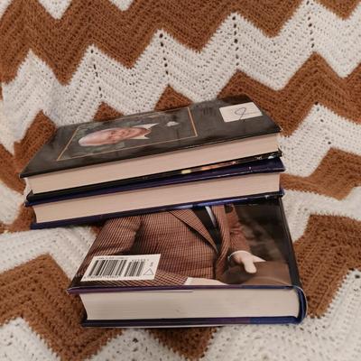 LOT 54: Collection of Stuart Wood and Sharon Kay Penman Hardback Novels with a Large Crocheted Throw Blanket
