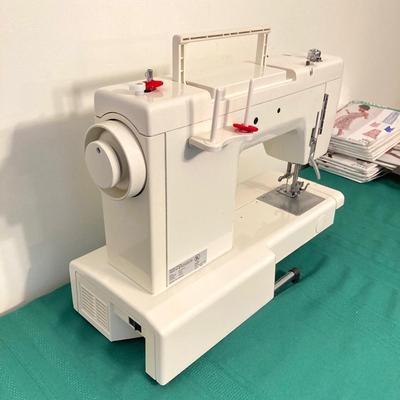 LOT 65: RICCAR Model R-1570 Sewing Machine with Large Collection of New Look Sewing Patterns and More