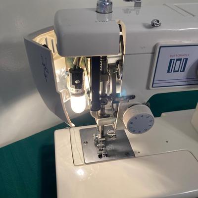 LOT 65: RICCAR Model R-1570 Sewing Machine with Large Collection of New Look Sewing Patterns and More