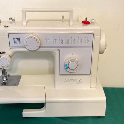 LOT 65: RICCAR Model R-1570 Sewing Machine with Large Collection of New Look Sewing Patterns and More