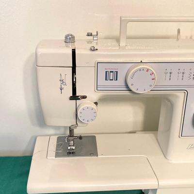 LOT 65: RICCAR Model R-1570 Sewing Machine with Large Collection of New Look Sewing Patterns and More
