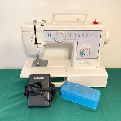 LOT 65: RICCAR Model R-1570 Sewing Machine with Large Collection of New Look Sewing Patterns and More