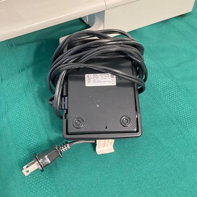 LOT 65: RICCAR Model R-1570 Sewing Machine with Large Collection of New Look Sewing Patterns and More