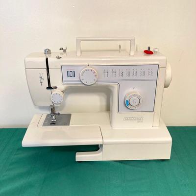 LOT 65: RICCAR Model R-1570 Sewing Machine with Large Collection of New Look Sewing Patterns and More