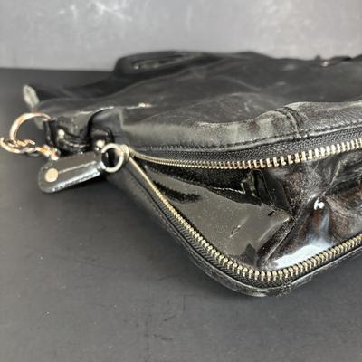 LOT 94: Coach Leather Fold-over Tote Shoulder Bag Model M0873-13380 along with a Coach Lather Zip Accordion Wallet