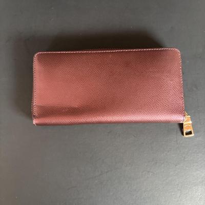 LOT 94: Coach Leather Fold-over Tote Shoulder Bag Model M0873-13380 along with a Coach Lather Zip Accordion Wallet