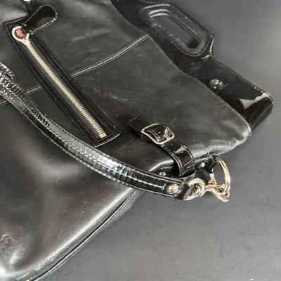 LOT 94: Coach Leather Fold-over Tote Shoulder Bag Model M0873-13380 along with a Coach Lather Zip Accordion Wallet