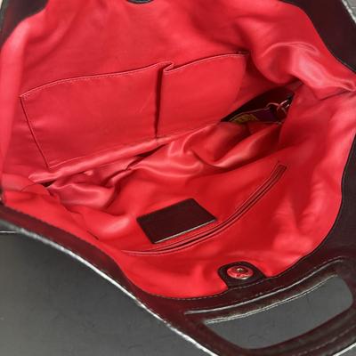 LOT 94: Coach Leather Fold-over Tote Shoulder Bag Model M0873-13380 along with a Coach Lather Zip Accordion Wallet