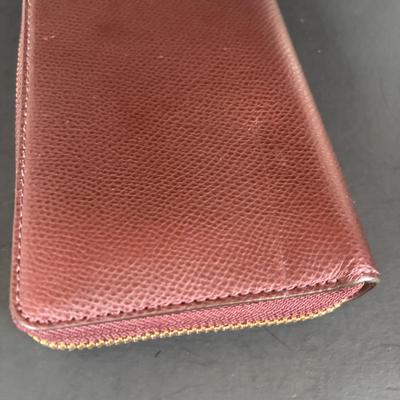 LOT 94: Coach Leather Fold-over Tote Shoulder Bag Model M0873-13380 along with a Coach Lather Zip Accordion Wallet