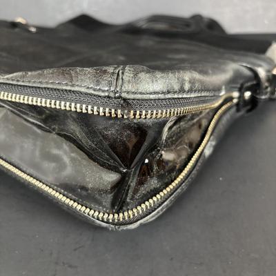 LOT 94: Coach Leather Fold-over Tote Shoulder Bag Model M0873-13380 along with a Coach Lather Zip Accordion Wallet