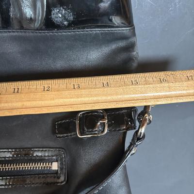 LOT 94: Coach Leather Fold-over Tote Shoulder Bag Model M0873-13380 along with a Coach Lather Zip Accordion Wallet