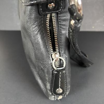 LOT 94: Coach Leather Fold-over Tote Shoulder Bag Model M0873-13380 along with a Coach Lather Zip Accordion Wallet