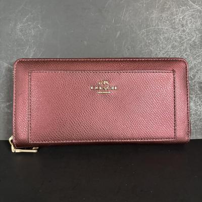 LOT 94: Coach Leather Fold-over Tote Shoulder Bag Model M0873-13380 along with a Coach Lather Zip Accordion Wallet