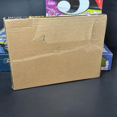 LOT 109: NIP Boad Games: Monty Python & the Holy Grail Python-Opoly, Name 5, Magnetic Battle Game, Trivia Pursuit & More