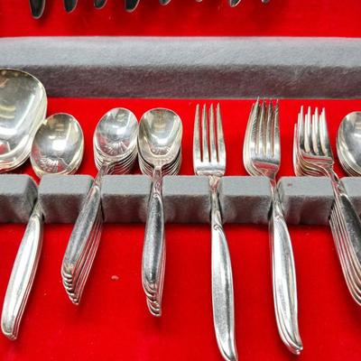 Sale Photo Thumbnail #469: Set for 12 ( 8 knives) with serving pieces in original tarnish proof box with COA. Lovely simple pattern Silver plate Service/6+  50's Mid-Century Modern ROGERS International Flatware SWEEP Pattern SWIRL in Handle w/Leaf Good Condition No Wear