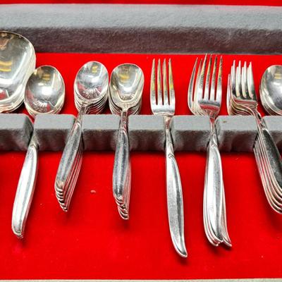 Sale Photo Thumbnail #463: Set for 12 ( 8 knives) with serving pieces in original tarnish proof box with COA. Lovely simple pattern Silver plate Service/6+  50's Mid-Century Modern ROGERS International Flatware SWEEP Pattern SWIRL in Handle w/Leaf Good Condition No Wear