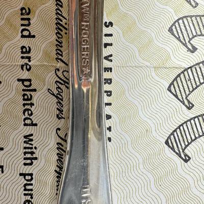 Sale Photo Thumbnail #465: Set for 12 ( 8 knives) with serving pieces in original tarnish proof box with COA. Lovely simple pattern Silver plate Service/6+  50's Mid-Century Modern ROGERS International Flatware SWEEP Pattern SWIRL in Handle w/Leaf Good Condition No Wear