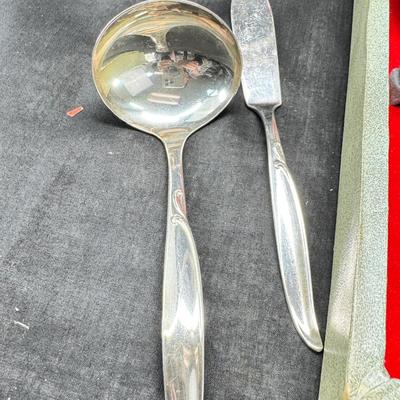 Sale Photo Thumbnail #468: Set for 12 ( 8 knives) with serving pieces in original tarnish proof box with COA. Lovely simple pattern Silver plate Service/6+  50's Mid-Century Modern ROGERS International Flatware SWEEP Pattern SWIRL in Handle w/Leaf Good Condition No Wear
