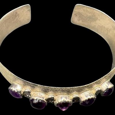 Sale Photo Thumbnail #105: [29.52g] This beautiful piece features amethyst cabochons in a satin sterling silver setting. Measurement: 2.25”W. Silver content confirmed using Niton XRF precious metals analyzer. [JP]