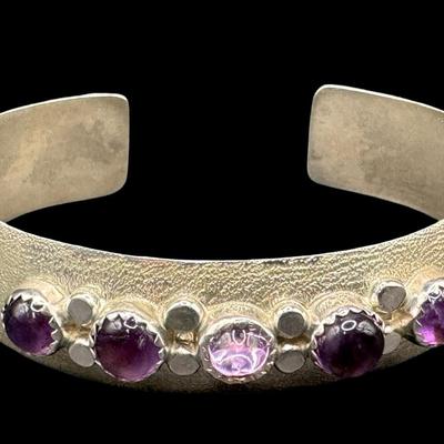 Sale Photo Thumbnail #102: [29.52g] This beautiful piece features amethyst cabochons in a satin sterling silver setting. Measurement: 2.25”W. Silver content confirmed using Niton XRF precious metals analyzer. [JP]