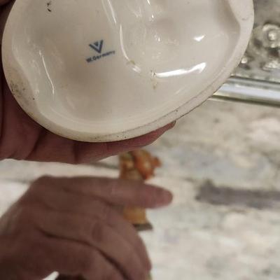 Sale Photo Thumbnail #135: Mirrored dresser tray with a pewter porringer, Hummel Girl with Geese, sleeping kitty, Bing and Grondahl thimble and a Zsolnay Bunny figurine