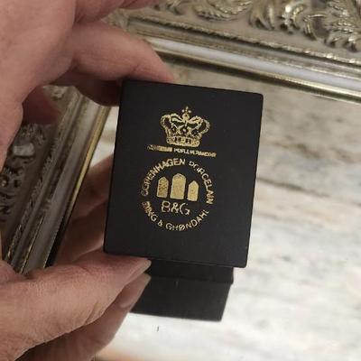 Sale Photo Thumbnail #133: Mirrored dresser tray with a pewter porringer, Hummel Girl with Geese, sleeping kitty, Bing and Grondahl thimble and a Zsolnay Bunny figurine