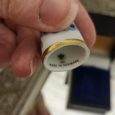 Sale Photo Thumbnail #131: Mirrored dresser tray with a pewter porringer, Hummel Girl with Geese, sleeping kitty, Bing and Grondahl thimble and a Zsolnay Bunny figurine