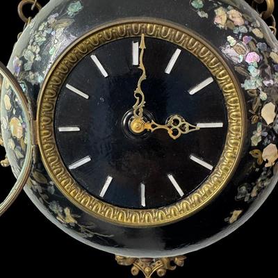 Sale Photo Thumbnail #126: Made in France, this Napoleon III era piece has a black lacquered finish with mother of pearl inlay, and brass accents. It includes a hanging chain. It has not been tested. Two screws are missing, but the piece is still sturdy. Measurement: 13.5” Diamet