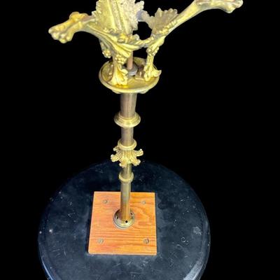 Sale Photo Thumbnail #136: These lacquered tables have mother of pearl flying cranes and clouds. The pedestals are constructed of brass and lacquered wood. There is some paint loss on the edges, and one base is not straight, and may have been bent at one time. Measurement: 16.5”H