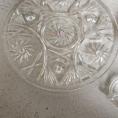 Sale Photo Thumbnail #195: Crystal cake plate, beautiful little blown creamer, vintage leaf bowl and a fantastic Egermann etched candy dish in cranberry