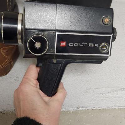 Sale Photo Thumbnail #207: Pair of old video cameras, Colt 84 and a gaf Anscomatic st/90 as well as a few old accessories