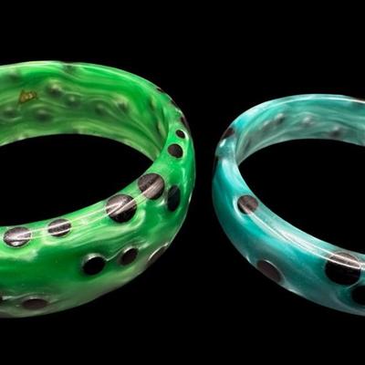 Sale Photo Thumbnail #161: Includes a pair of spotted lucite bangle bracelets. These are sometimes referred to as “acetate bangles.” Measurement: 3” Diameter (each). [JP]