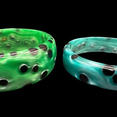 Sale Photo Thumbnail #162: Includes a pair of spotted lucite bangle bracelets. These are sometimes referred to as “acetate bangles.” Measurement: 3” Diameter (each). [JP]