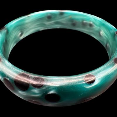 Sale Photo Thumbnail #164: Includes a pair of spotted lucite bangle bracelets. These are sometimes referred to as “acetate bangles.” Measurement: 3” Diameter (each). [JP]