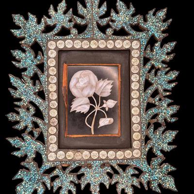 Sale Photo Thumbnail #165: This piece features crushed turquoise enameled into a brass frame, with rhinestones along the border. A mother of pearl rose serves as the focal point of the piece. The bottom right shows some cracks in the enamel, but there is no stone loss. Measurement: