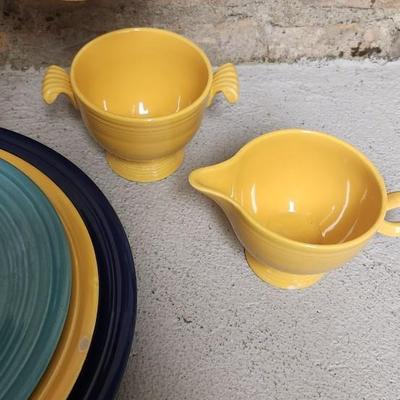 Sale Photo Thumbnail #332: Cobalt Chop plate, Sunflower Dinner Plate (chipped), Turquoise Lunch plate. Pair of salt and peppers and a harlequin cream and sugar