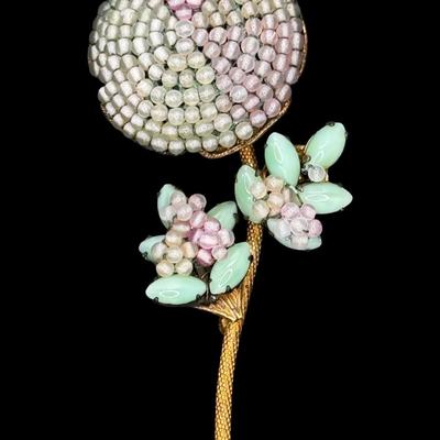 Sale Photo Thumbnail #185: This ornate costume piece was designed by Frank Hess, who also designed for Miriam Haskell. It has detailed filigree with hand blown colored glass beads and marquise cut jadeite. It was made in NYC. Measurement: 3.75”L. Pre-auction estimate: $100-$200. 