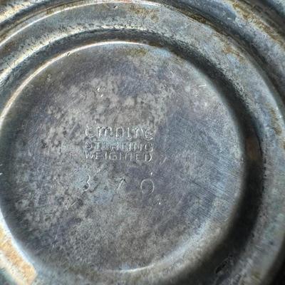 Sale Photo Thumbnail #196: [559g] These Empire candlesticks are weighted, and have tarnish throughout. Measurement: 4.25”H x 3.5”W (each). [JP]