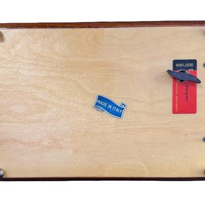 Sale Photo Thumbnail #202: Made by Reuge, in Italy. This piece has fine marquetry inlay in a floral motif, and an internal music box. Includes the original key. Measurement; 12”L x 6.5”W. Pre-auction estimate: $100-$150. [JP]